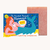 The Printed Peanut mermaid rose natural handmade soap. The decorative packaging box is shown next to the pink bar of soap. 