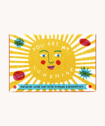 The Printed Peanut sunshine natural handmade orange and grapefruit soap. The bar is shown in a decorative packaging box. 