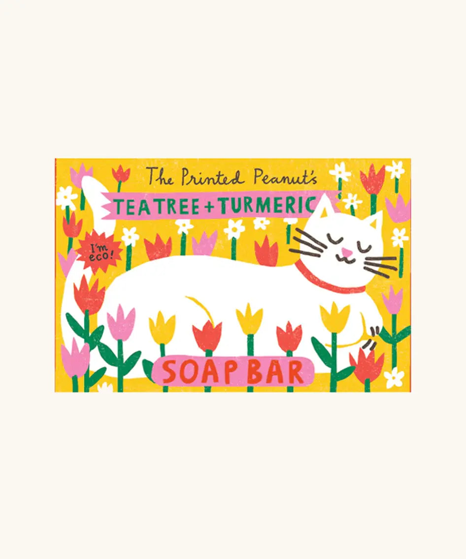 The Printed Peanut tea tree & turmeric natural handmade soap bar yellow decorative box showing a white cat lying down on flowers