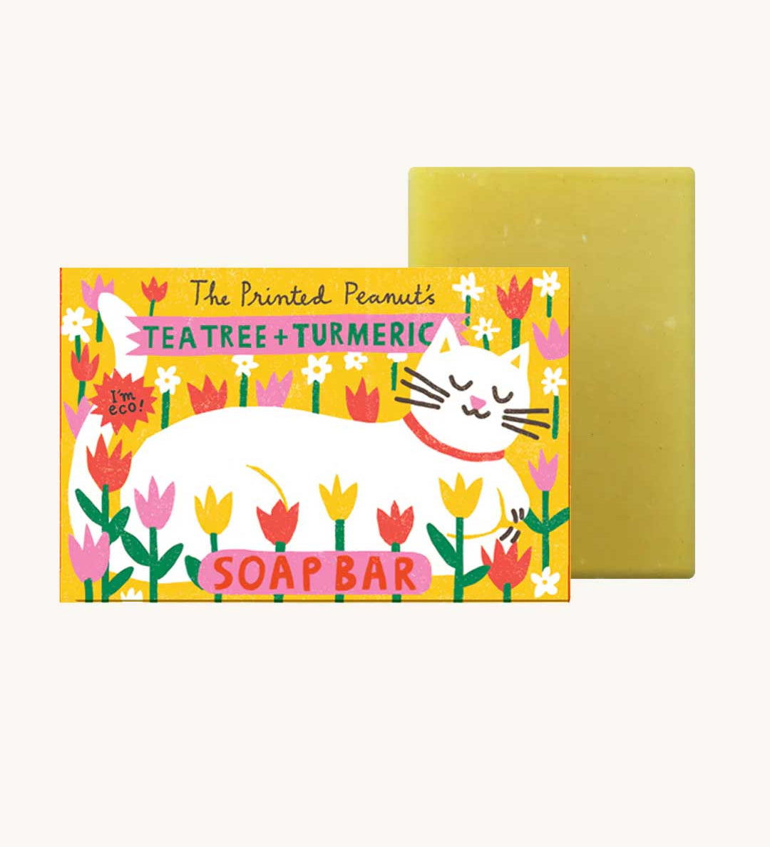The Printed Peanut tea tree & turmeric natural handmade soap bar in a decorative cardboard packaging box.