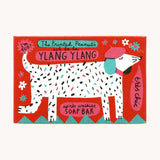 The Printed Peanut ylang ylang natural handmade soap shown in it's decorative cardboard packaging box.