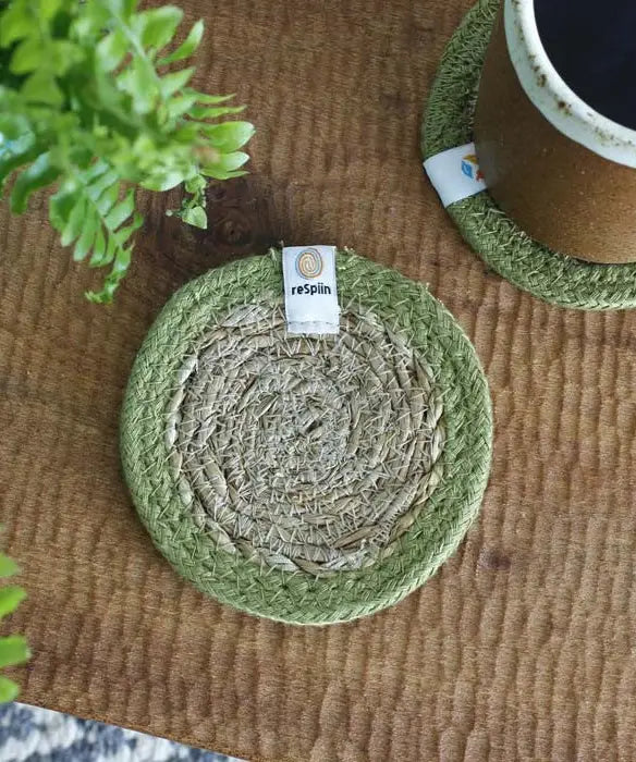ReSpiin natural jute coaster with green rim on a table 