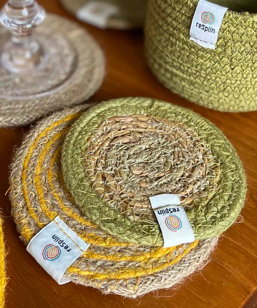 ReSpiin jute coaster with green rim on a table showing woven detail