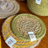 ReSpiin jute coaster with green rim on a table showing woven detail