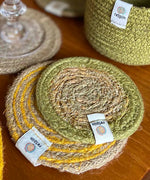 ReSpiin jute coaster with green rim on a table showing woven detail