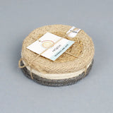 Stack of 6 ReSpiin natural jute coasters held by yarn