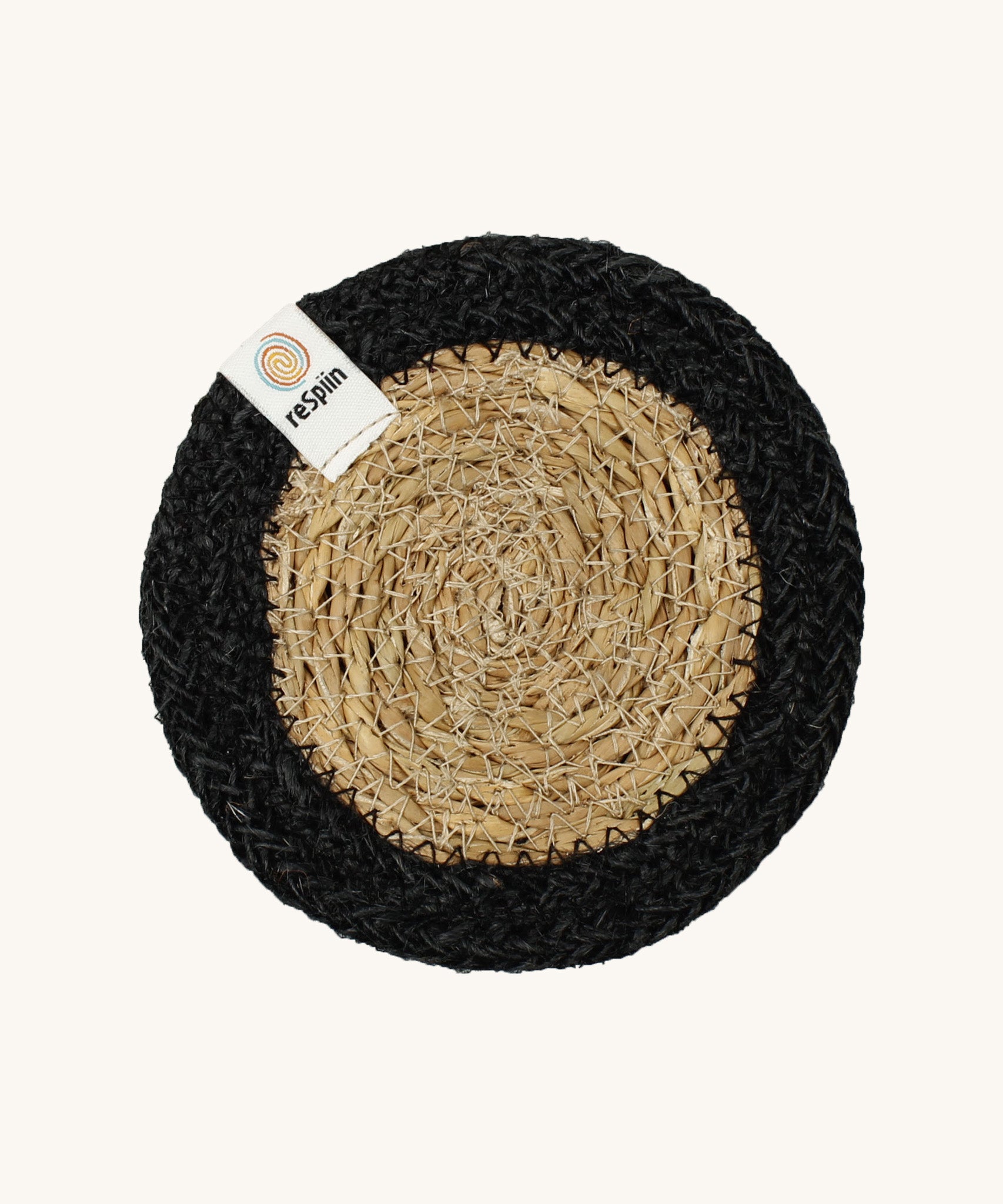 The ReSpiin natural jute and seagrass coaster in black.
