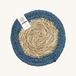 The ReSpiin natural jute and seagrass coaster in denim blue.