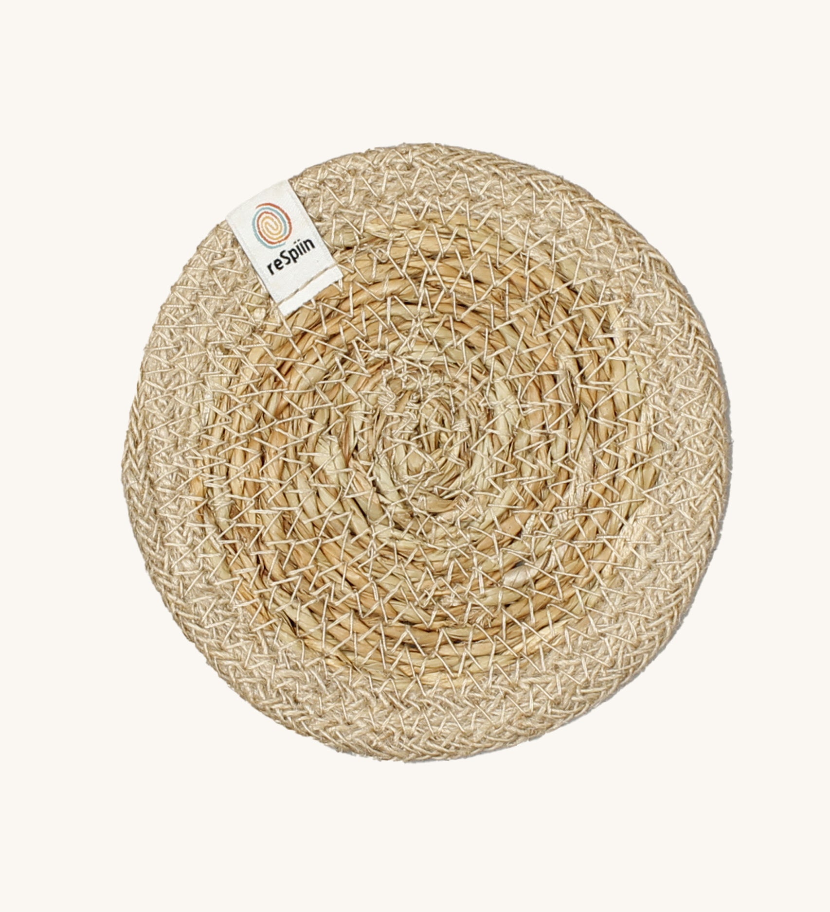 The ReSpiin natural jute and seagrass coaster in natural.