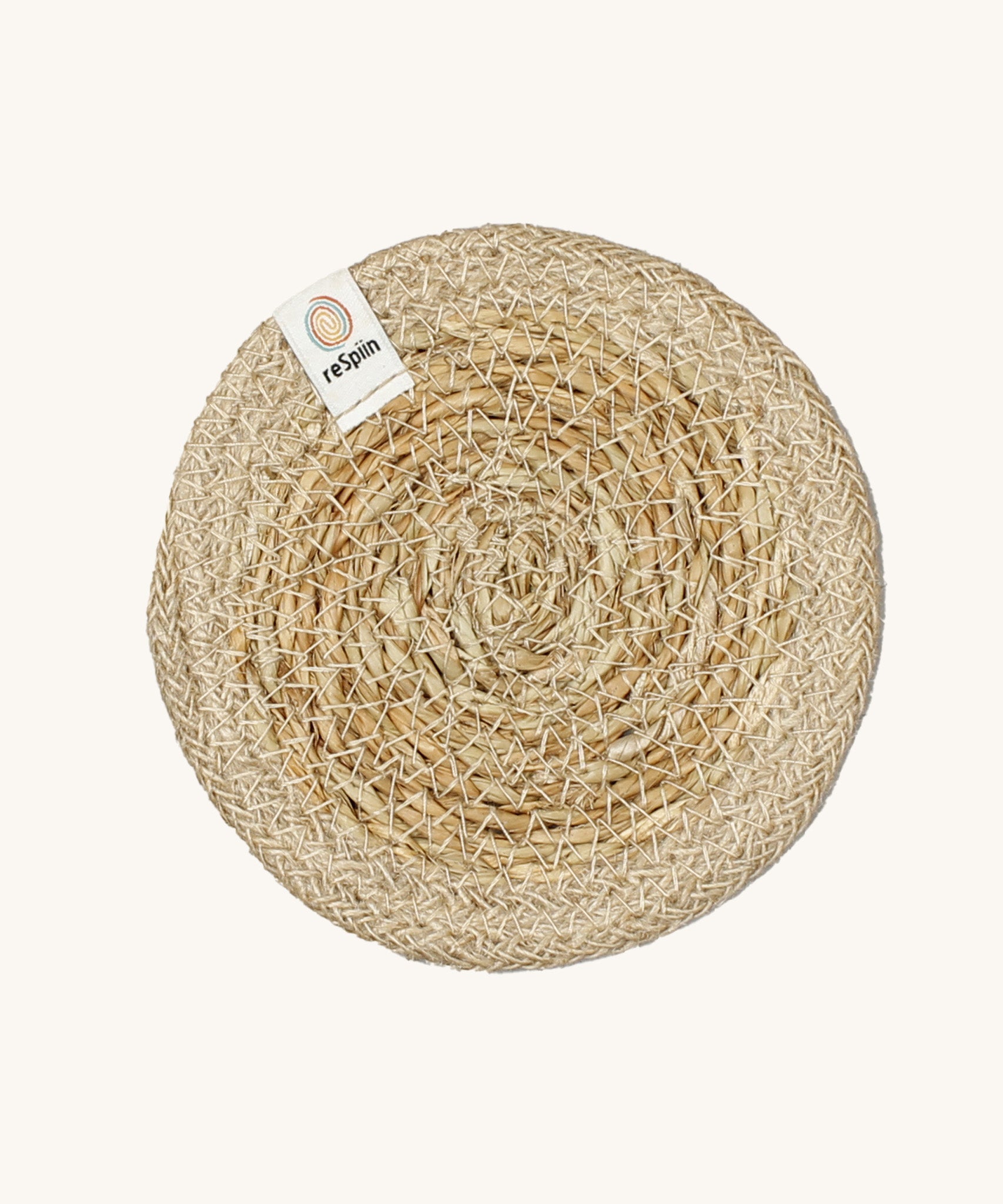 The ReSpiin natural jute and seagrass coaster in natural.