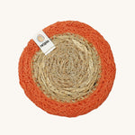 The ReSpiin natural jute and seagrass coaster in orange.