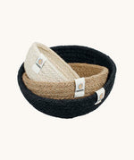 Respiin set of 3 natural mini bowls in natural, cream and black colour stacked on a cream background.
