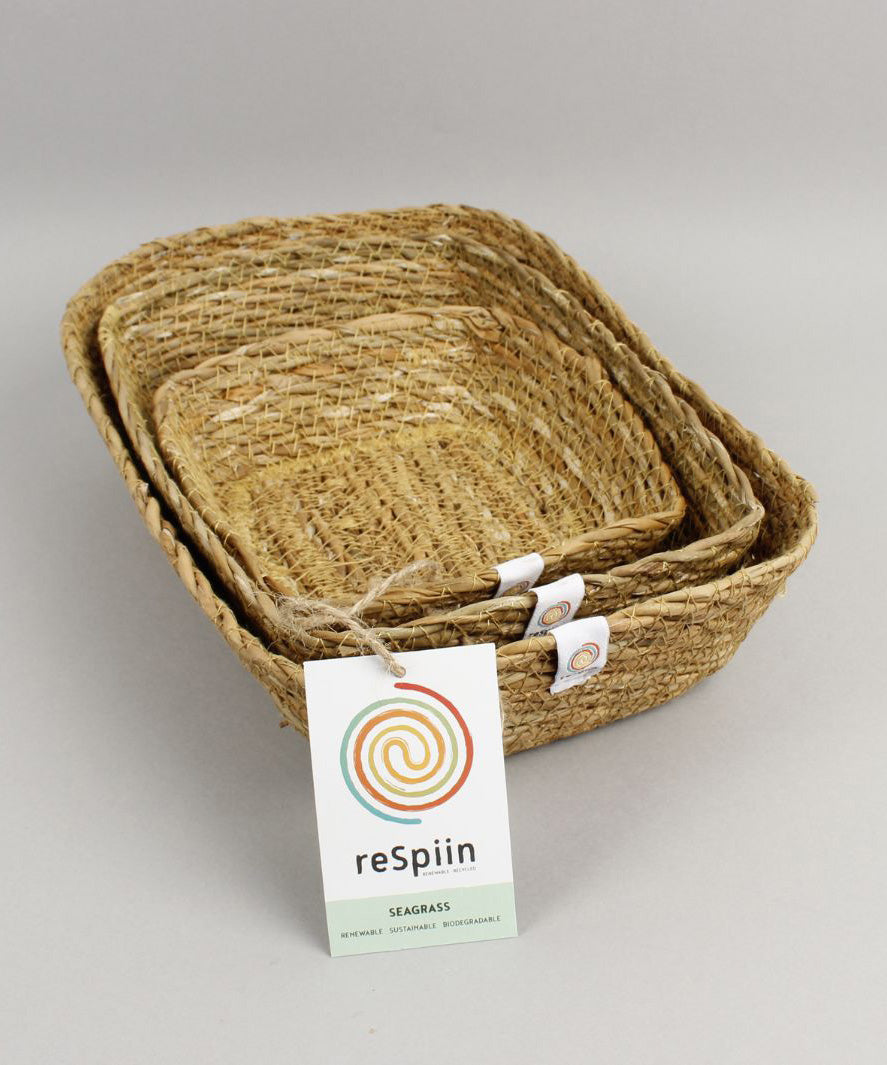 A close up view of the Respiin rectangular seagrass baskets inside eachother  showing the woven detail. 