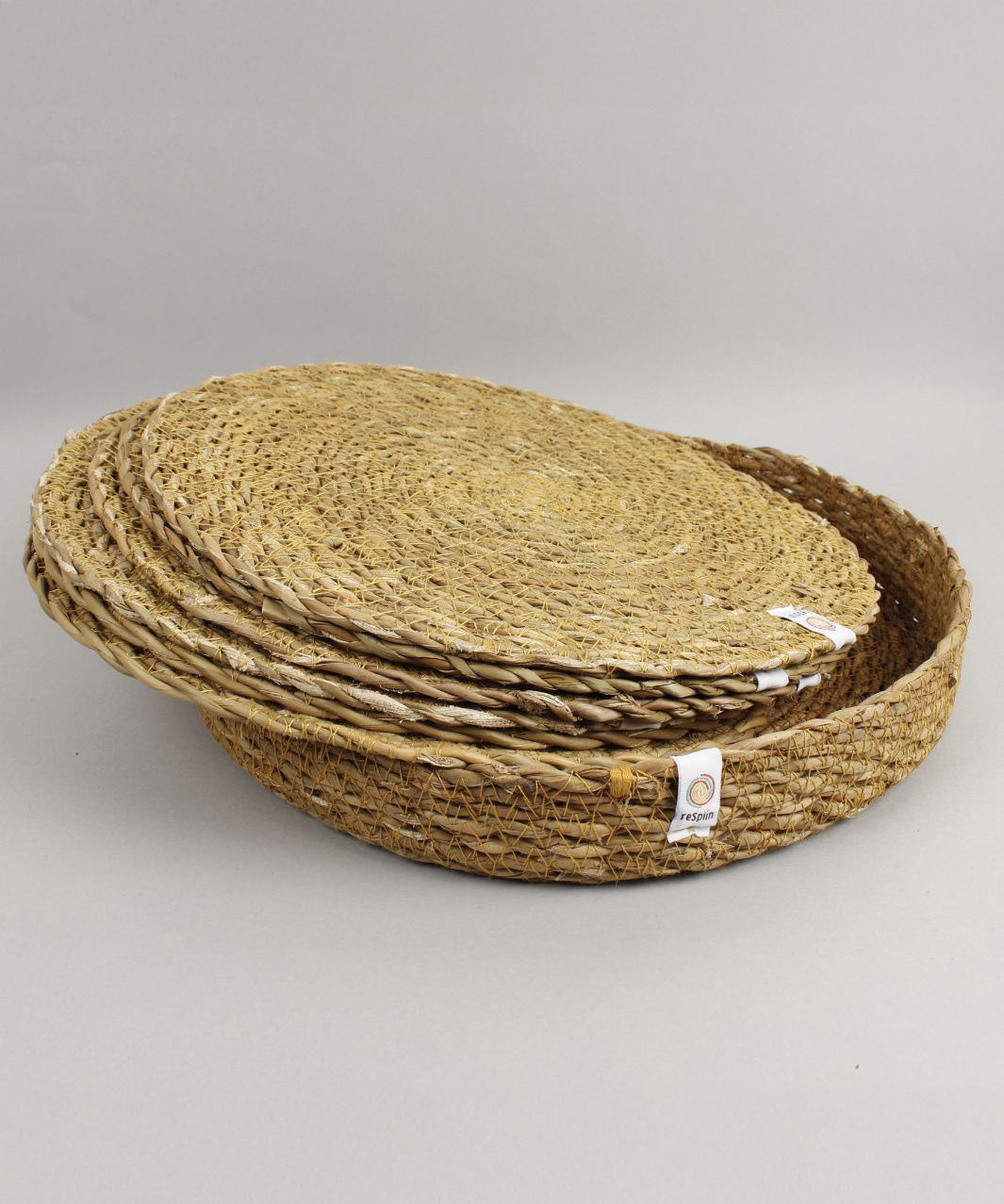 A close up view of the Respiin seagrass tablemat inside the matching holder 