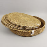 A close up view of the Respiin seagrass tablemat inside the matching holder 