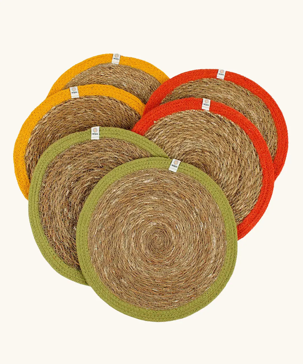 Respiin set of 6 jute table mats laid flat showing green, orange and yellow rim on each mat