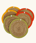Respiin set of 6 jute table mats laid flat showing green, orange and yellow rim on each mat