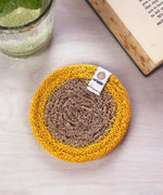 ReSpiin natural jute coaster with yellow  rim on a table 