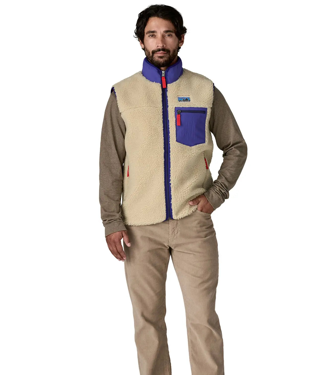 man casually standing wearing patagonia retro-x vest