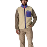 man casually standing wearing patagonia retro-x vest