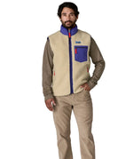 man casually standing wearing patagonia retro-x vest