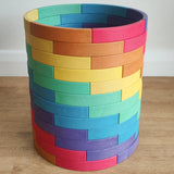 Abel blocks mini rewood Rainbow wooden stacking blocks stacked up to create a cylinder.