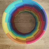 Overhead view of the Abel blocks mini rewood Rainbow wooden stacking blocks stacked up to create a cylinder.