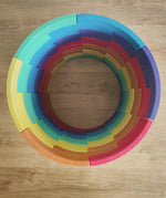Overhead view of the Abel blocks mini rewood Rainbow wooden stacking blocks stacked up to create a cylinder.