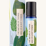 Roll On Don't Stress Essential Oil Blend a blue glass bottle next to decorative blue cardboard box. 