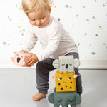 A child playing with the Roommate Jungle Life Stacking Blocks.