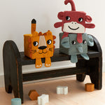 A child stacking the Roommate Soft Animal Stacking Blocks