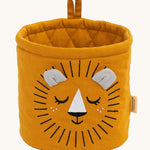 The Roommate Mini Quilted Basket - Lion in mustard yellow, with a sleepy embroidered face, and two small fabric ears in grey, and a mustard yellow hanging loop