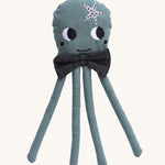 A Roommate octopus rag doll on a plain background. 
