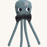 A Roommate octopus rag doll on a plain background. 