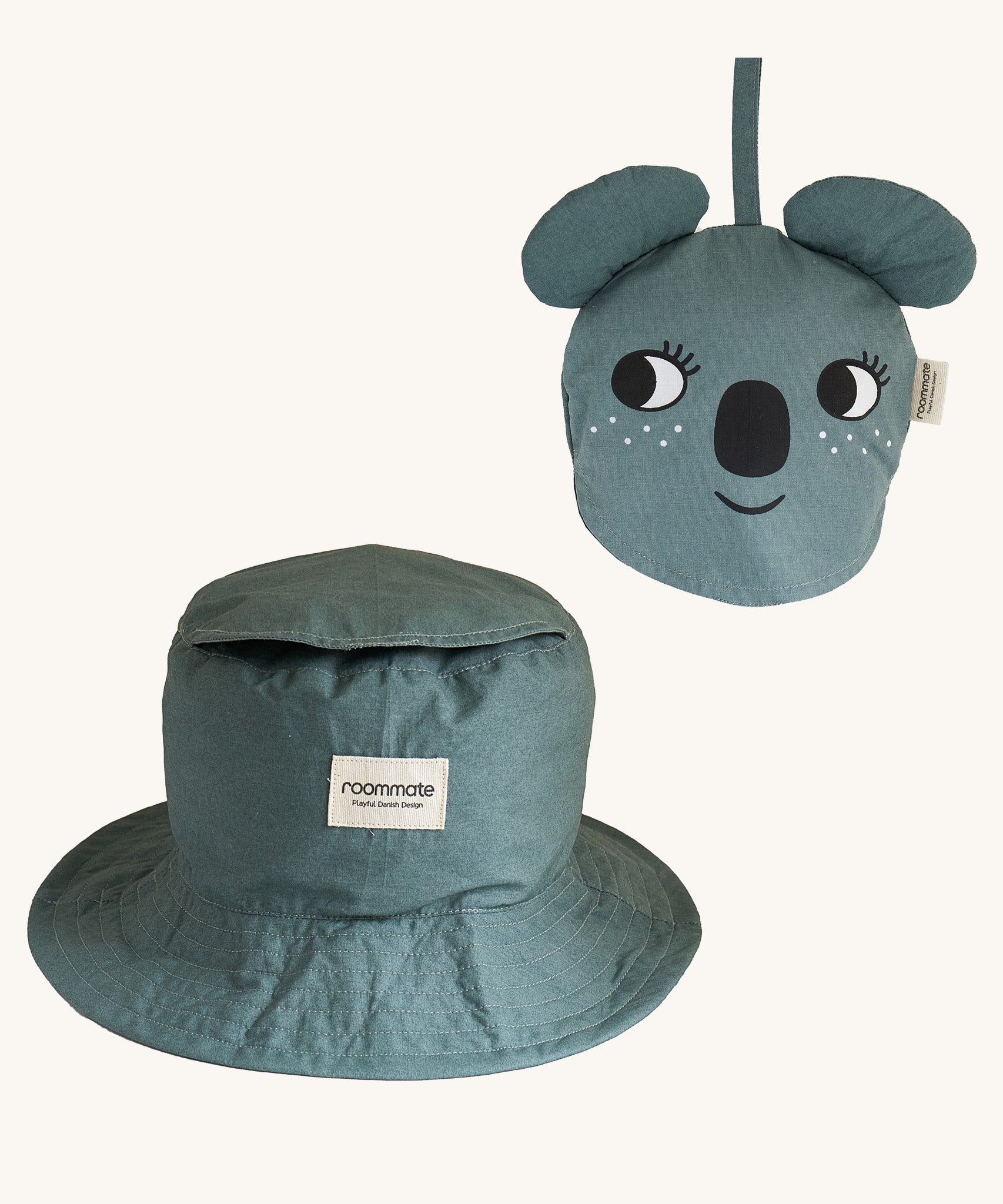 Two Roommate Koala bucket hats, one is opened up into the bucket hat form, and another is folded into itself to create a koala face. 