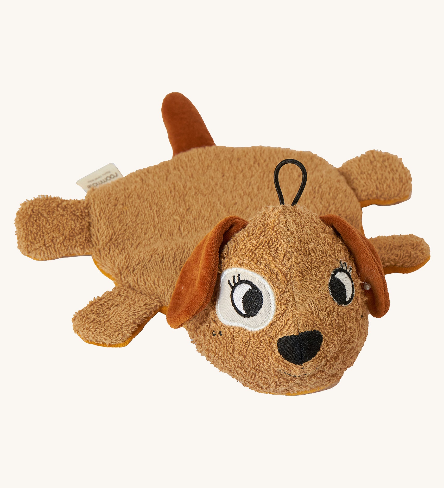 Brown organic cotton dog washcloth bath toy by Roommate, shown lying flat on a light background, with embroidered puppy face, floppy ears, four small legs, a tail, and a hanging loop on the head.