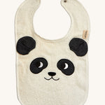 The Roommate Panda Baby Bib in organic cotton with embroidered panda face with 3D ears. Cream background.