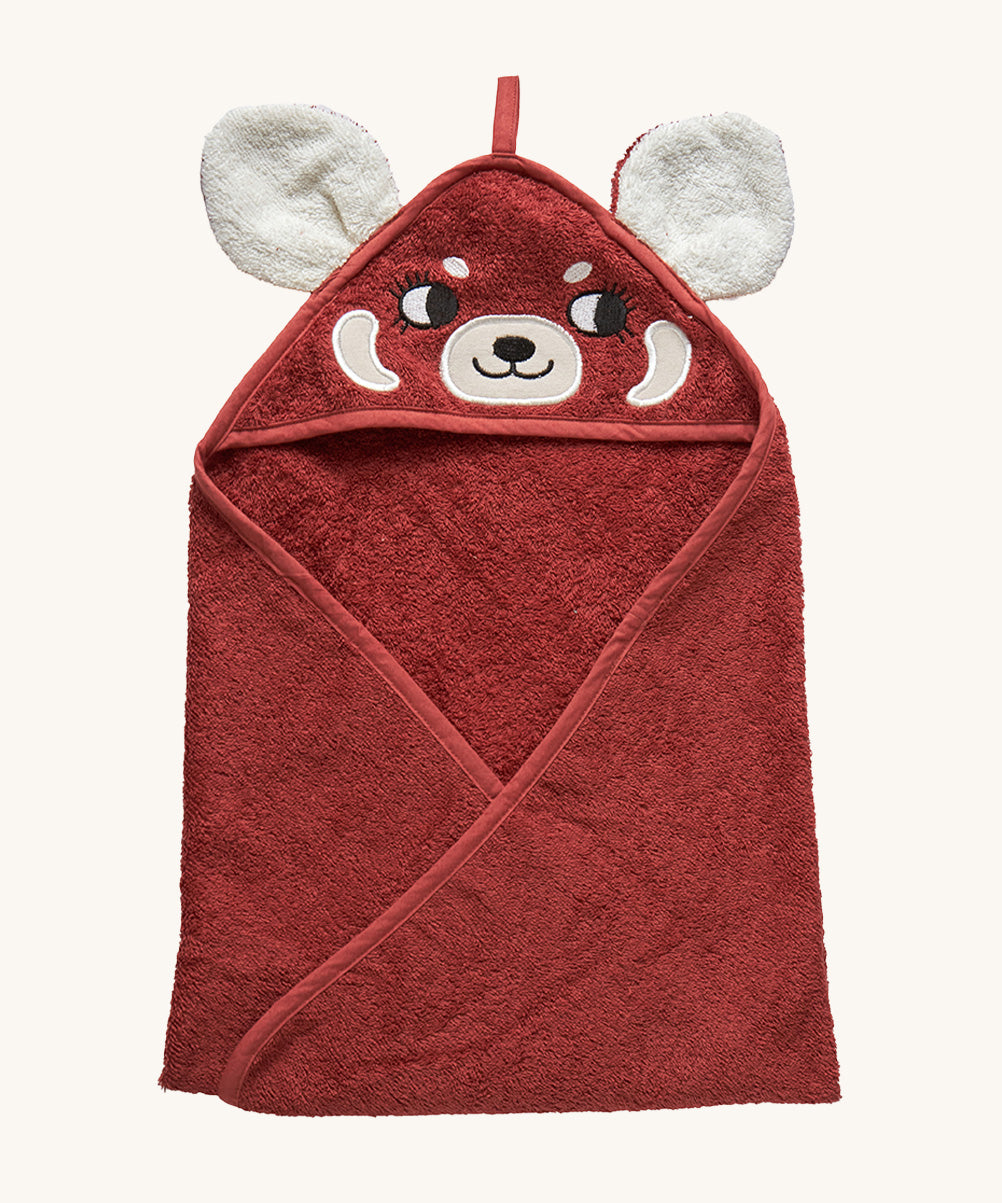 A hooded towel for children from Roommate, in a bright red colour with an embroidered red panda face on the hood and 3D panda ears. 