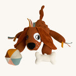 Roommate Activity Dog toy with a cute embroidered face, big soft floppy ears, and toy attachments. Designed with fun details for tiny fingers to fiddle with. This product has many different textures and sounds