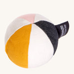 Roommate Canvas Sensory Ball - Rose. A fun soft fabric ball with pink, navy, yellow a white strips and a bell inside