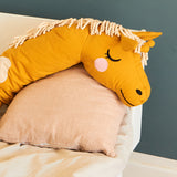  softly sleeping in a bedroom with other Roommate toys and items surrounding