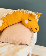 softly sleeping in a bedroom with other Roommate toys and items surrounding