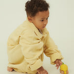  and wooden wheels on a cream background