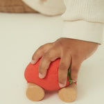  and wooden wheels on a cream background