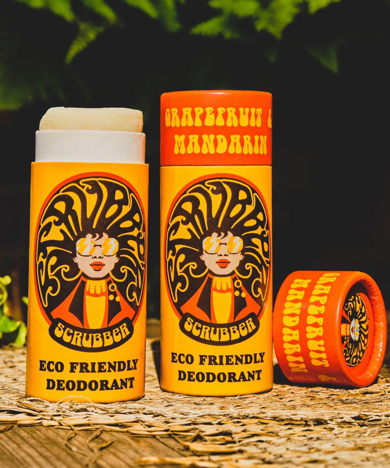Two of The Scrubber plastic-free natural deodorants with groovy packaging, in a grapefruit and mandarin scent