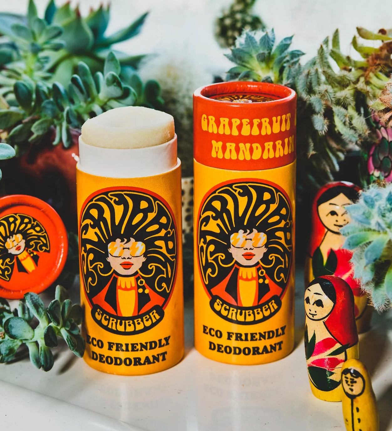 Two of The Scrubber plastic-free natural deodorant with groovy packaging, in a grapefruit and mandarin scent