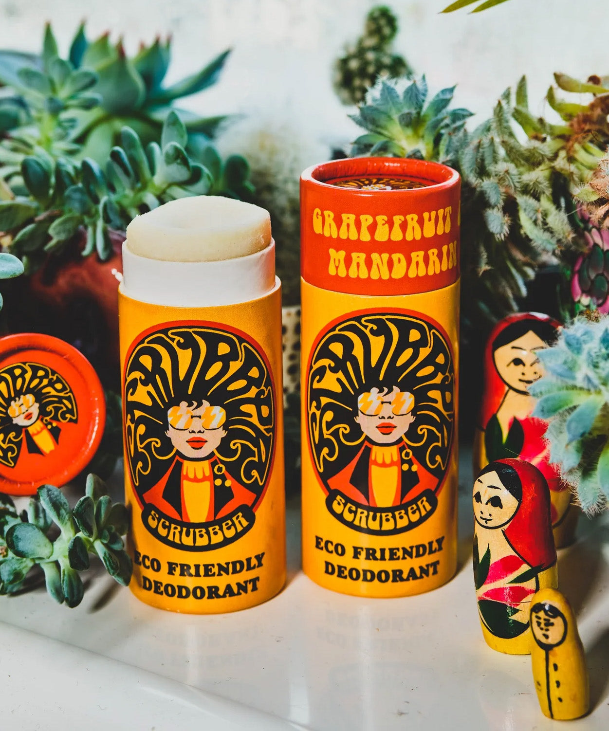 Two of The Scrubber plastic-free natural deodorant with groovy packaging, in a grapefruit and mandarin scent