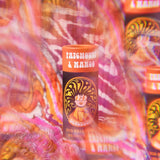 The Scrubber plastic-free natural deodorant with groovy packaging, on a psychedelic background