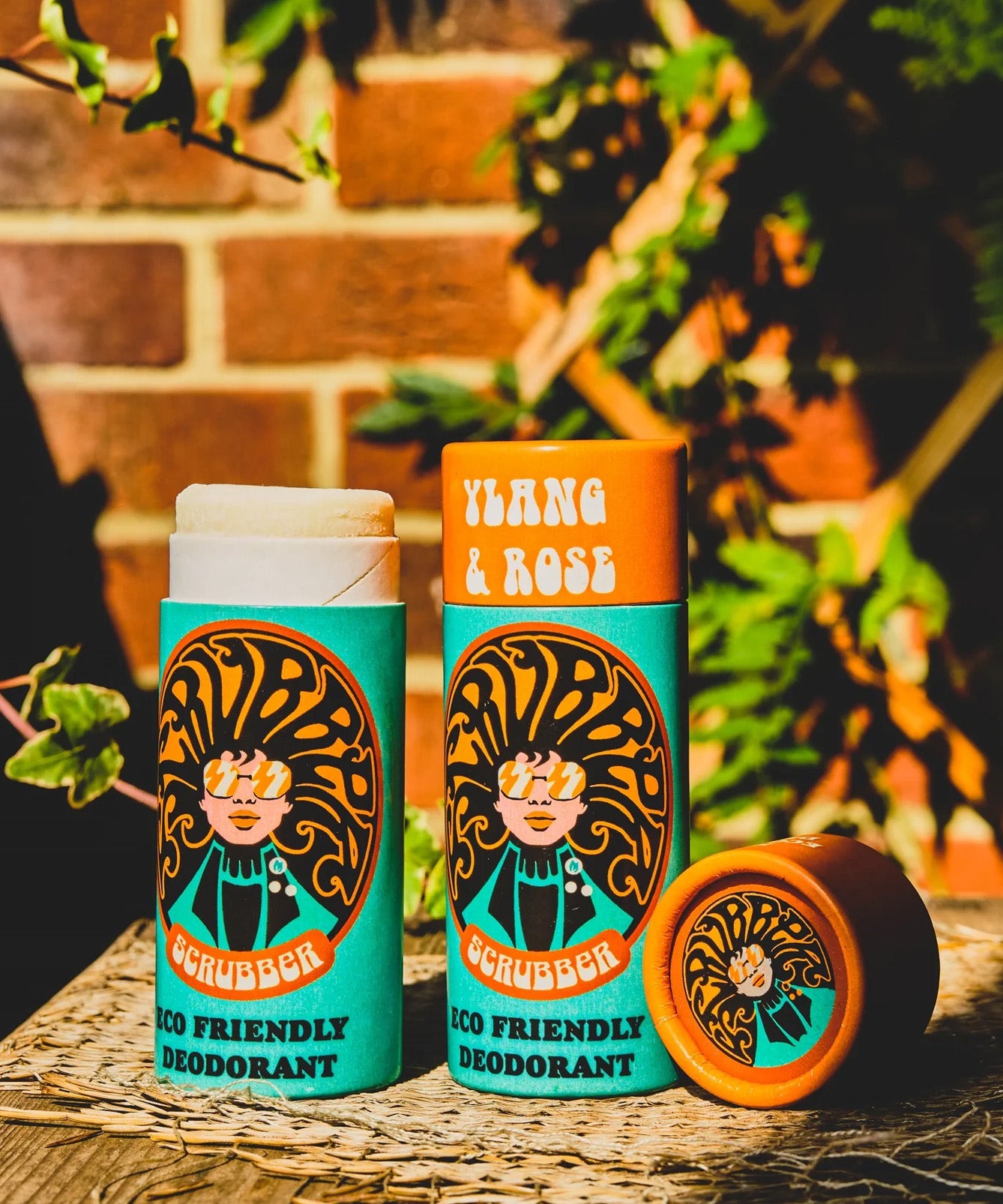 Two of The Scrubber plastic-free natural deodorant with groovy packaging, in a ylang and rose scent