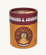 The Scrubber natural powder dry shampoo in 100% recycled cardboard packaging, in a tangerine and jasmine scent